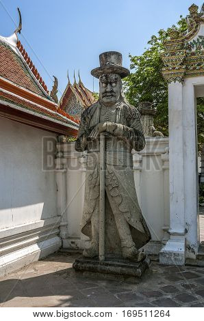 Thailand Bangkok. Temple of the Reclining Buddha (Wat Pho). Statue of farang (Thai so called Europeans) made by Chinese craftsmen.