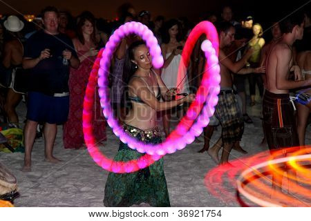 Whirling Dancers And Spectators At A Drum Circle On Siesta Key Near Sarasota, Florida