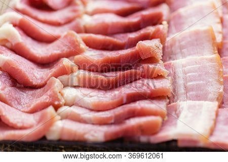 Bacon Slices Close-up. Fresh Cooked Food. Fresh Cold Sliced Bacon On The Background Of Natural Linen