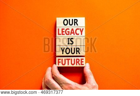 Legacy And Future Symbol. Concept Words Our Legacy Is Your Future On Wooden Blocks. Beautiful Orange