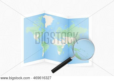 Enlarge Solomon Islands With A Magnifying Glass On A Folded Map Of The World. Vector Paper Map.