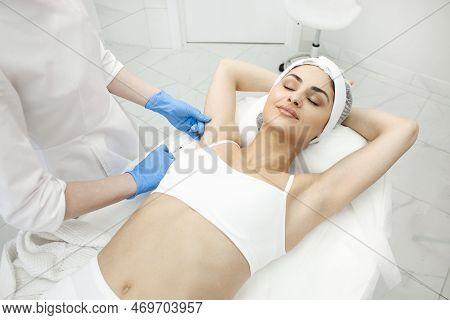 Armpit Botox Procedure In Cosmetology Clinic, Woman Patient Makes Armpit Botox Injection