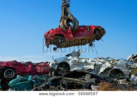 Crane Picking Up Car