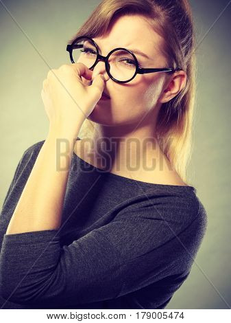 Girl Pinches Her Nose Because Of Stench Stink.