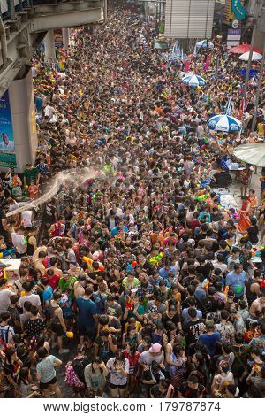 Bangkok, Thailand - April 13, 2014 : The Songkran festival or Thai New Year's festival on Silom street in Bangkok, Thailand.