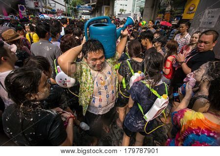 Bangkok, Thailand - April 13, 2014 : The Songkran festival or Thai New Year's festival on Silom street in Bangkok, Thailand.