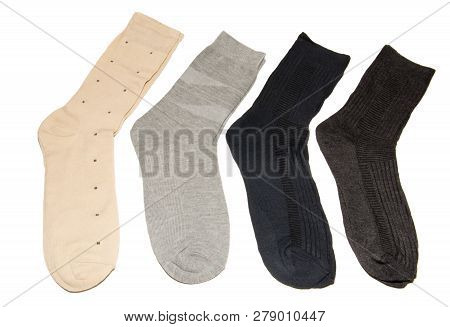 Four Pairs Of Multi-colored Thin Socks. Thin, Summer Running Socks. Isolated On White Background.