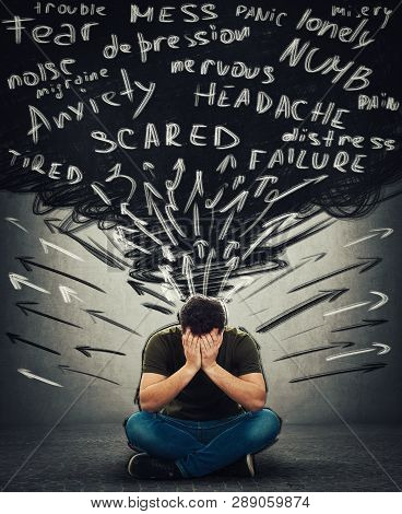 Stressed Man Sitting On Floor Covering Face Feel Sad And Desperate Having Anxiety, Distress Depressi