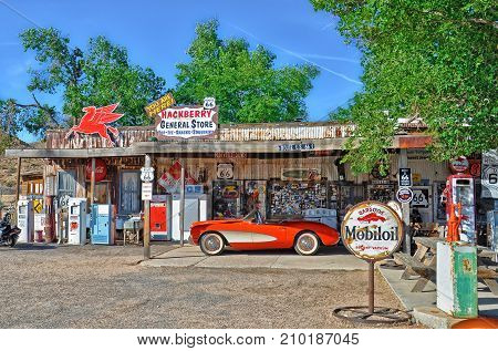 HACKBERRY, ARIZONA, USA - MAY 15, 2013: A 1957 red Corvette outside the antique Hackberry General Store on Route 66, Arizona