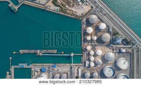 Aerial view Oil refinery.Industrial view at oil refinery plant form industry zone with sunrise and cloudy sky.Oil refinery and Petrochemical plant at duskThailand. Oil refinery background sunset.