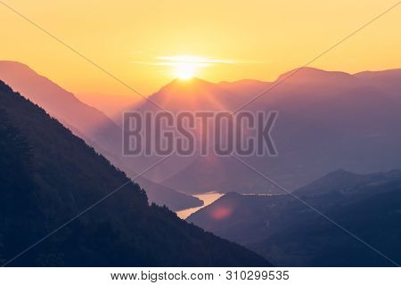 Sunset In Mountain Landscape. Mountain Layers In Sunset. Sunset In The Mountain River Landscape. Riv