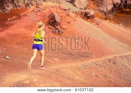 Young Woman Running In Mountains Summer Sunset