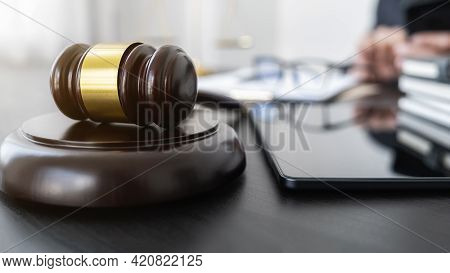 Professional Lawyer Considering With Contract Papers In Courtroom. Justice, Law, Attorney And Court 