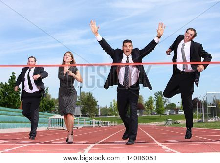 Businesspeople crossing the finish line