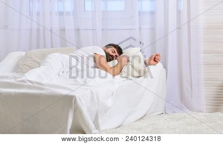 Guy On Calm Face Sleeping On White Sheets, Pillow. Nap And Siesta Concept. Man Laying On Bed, Covere