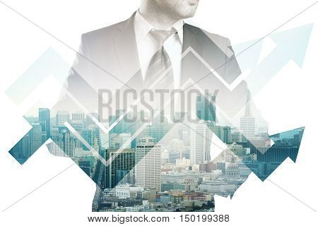 Businessman in suit and abstract business chart arrows on city background. Double exposure. Financial growth concept