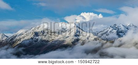 First snow at tops of mountains. Dawn. Greater Caucasus Mountain Range. Caucasus mountains. Karachay-Cherkessia. Russia.  