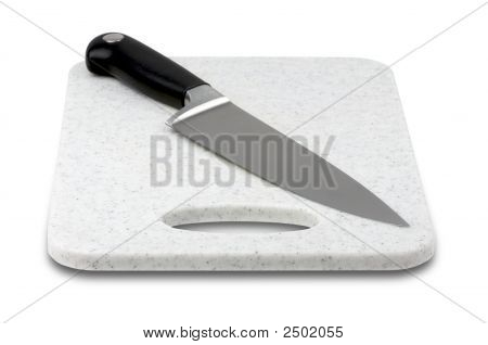 Large Knife On Cutting Board