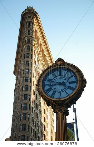 NEW YORK CITY - DEC 7: Flat Iron building, considered to be one of the first skyscrapers ever built, with New York City street view. December 7, 2009 in Manhattan, New York City.