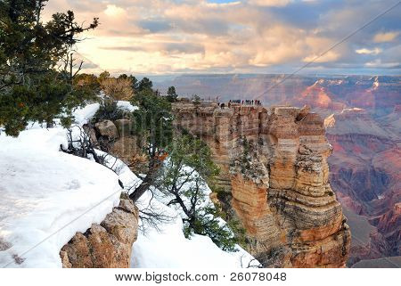 Grand Canyon panorama view in winter with snow and clear blue sky.