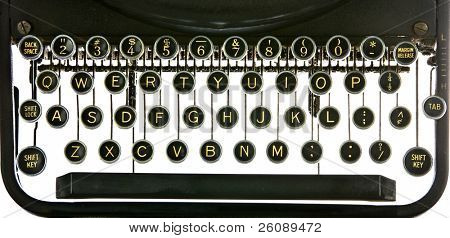 Vintage typewriter keyboard, backlit on white. Includes alphabet, numerals, shift key, backspacer, and tabulator.