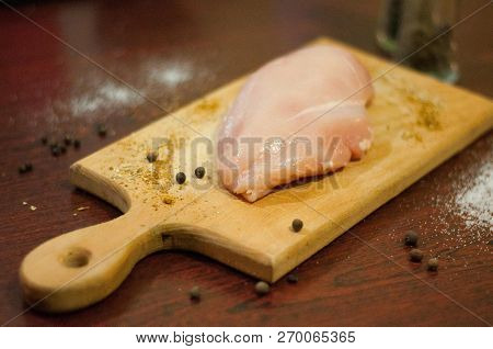 Raw Chicken Meat. Fillet Of Poultry. Wooden Plank