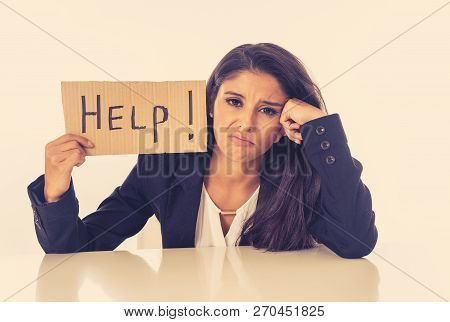 Beautiful Young Business Woman Overwhelmed And Tired Holding A Help Sign