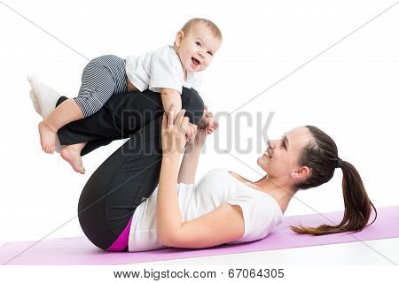 Mother With Baby Doing Gymnastics And Fitness Exercises