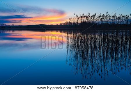 Beautiful Lake With Colorful Sunset Sky. Tranquil Vibrant Landscape