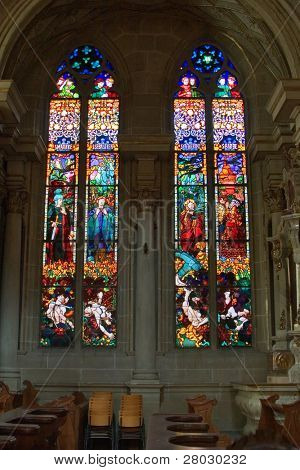  Bright multi-colour stained-glass windows in an ancient cathedral in Switzerland