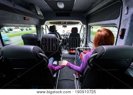 Family travelling in minivan to airport. People on public transport bus or van are travelling to airport for vacation. Aerodrome transfer service vehicle.