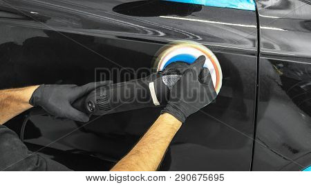 Car Polish Wax Worker Hands Applying Protective Tape Before Polishing. Buffing And Polishing Car. Ca