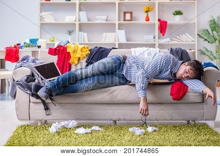 Young man working studying in messy room