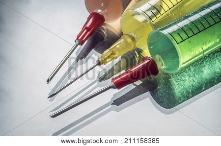 Several types of syringes for palliative care, conceptual image