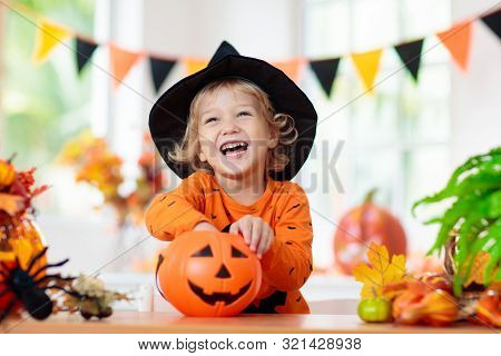 Child In Halloween Costume. Kids Trick Or Treat.