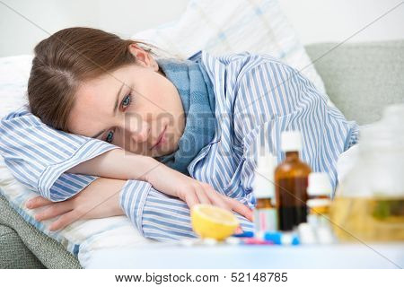 Sick Woman Lying In Bed