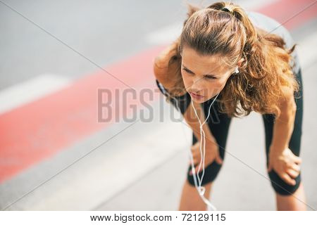 Portrait Of Tired Fitness Young Woman Outdoors In The City Catch