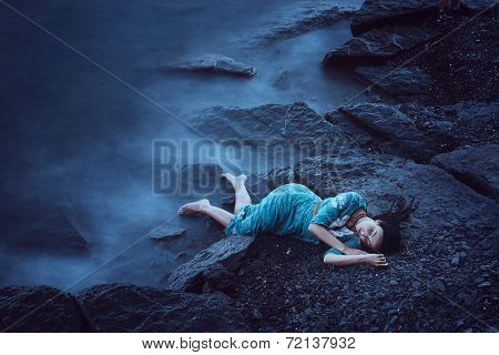 Beautiful young woman on sea