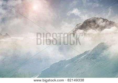 Winter Mountain Peaks At Sunset