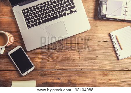 Desktop mix on a wooden office table.