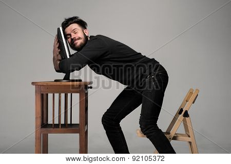 Funny and crazy man using a computer