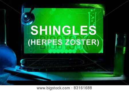 Computer with words Shingles (Herpes zoster).