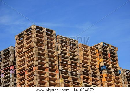 Stacked wooden pallets at a pallet storage