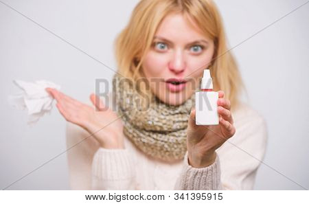 Nasal Spray Using. Cute Woman Nursing Nasal Cold Or Allergy. Unhealthy Girl With Runny Nose Using Na