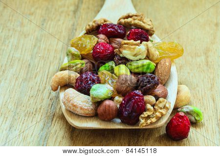 Varieties Of Dried Fruits And Nuts On Wooden Spoon.