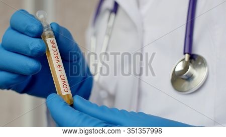 Medical Doctor Or Laborant Holding Tube With Ncov Coronavirus Vaccine For 2019-ncov Covid Virus. Nov