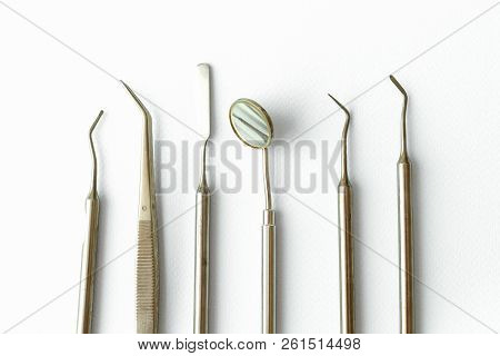 Professional Dentist Tools In Dental Office: Dentist Mirror, Forceps Curved, Explorer Curved, Dental