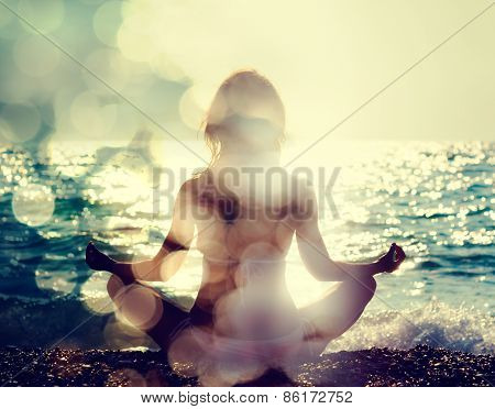 Woman Practicing Yoga by the Sea