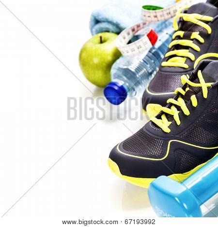 Different tools for sport and healthy food for diet on white background - sport, health and diet concept