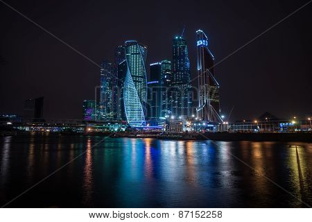 Picturesque Night View Of The Moscow City Across The River Moscow With Reflection In Water,